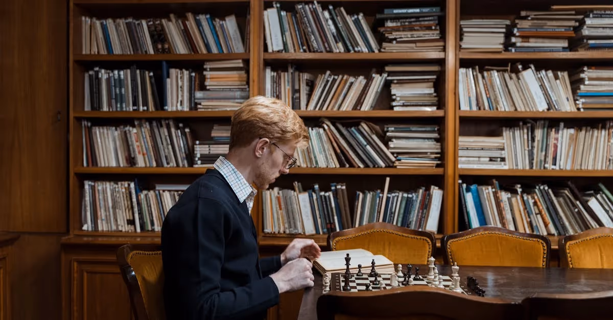 man playing chess with books