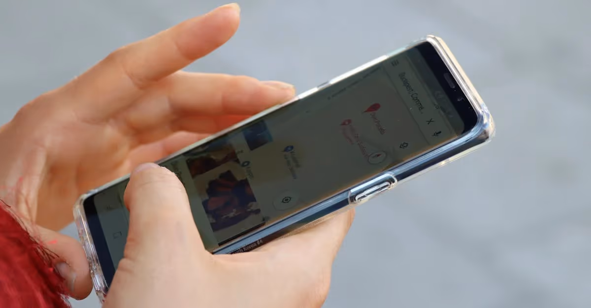 person holding mobile device
