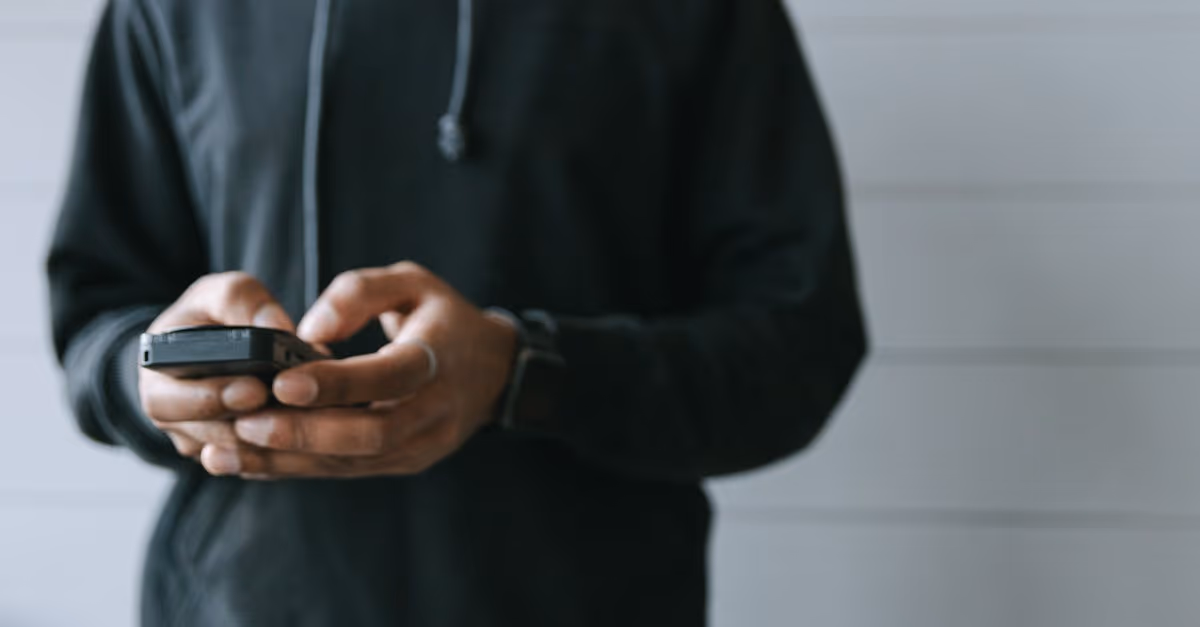 man with ihphone in hand